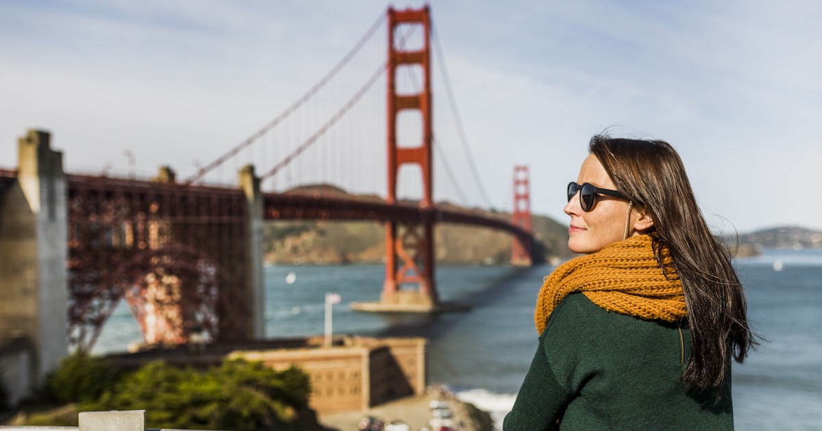 Woman standing against Golden Gate Bridge